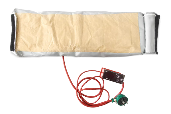 Photograph documenting visible closure and shaped-blanket form for heated component